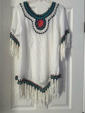Boho White Crochet-Trim Fringe Tunic Top is a size Medium.